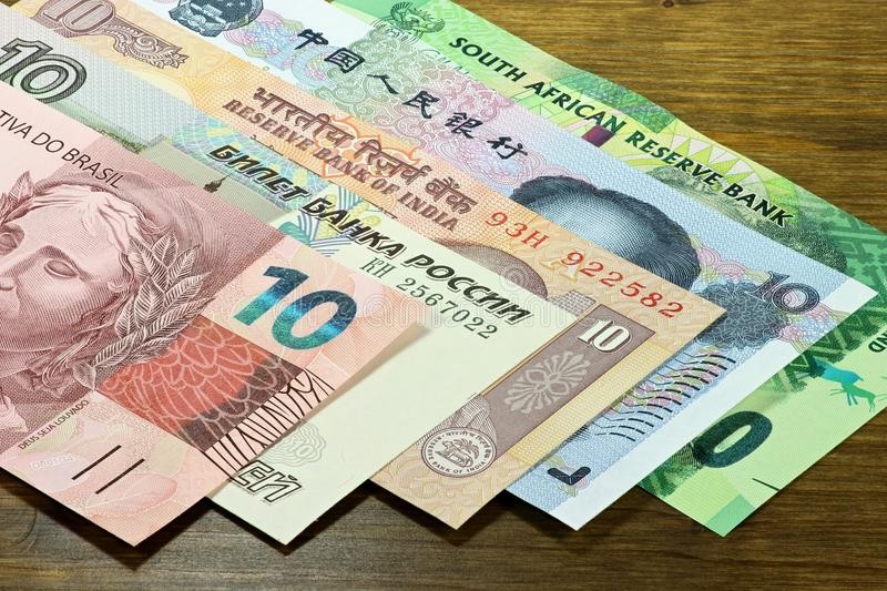 brics-bank-notes-states-wooden-background-65158155